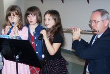 youth playing instruments with Rudy